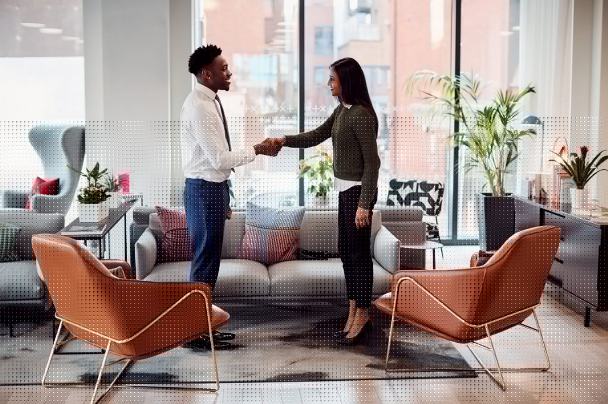 /assets/businesswoman-shaking-hands-with-male-interview-ca-2023-11-27-05-00-11-utc-min.jpg